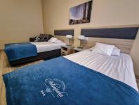 Posteľ alebo postele v izbe v ubytovaní Antonińska Hotel & Apartamenty