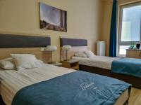 Posteľ alebo postele v izbe v ubytovaní Antonińska Hotel & Apartamenty