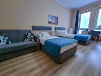Posteľ alebo postele v izbe v ubytovaní Antonińska Hotel & Apartamenty