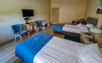 Posteľ alebo postele v izbe v ubytovaní Antonińska Hotel & Apartamenty