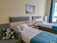 Posteľ alebo postele v izbe v ubytovaní Antonińska Hotel & Apartamenty