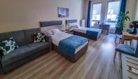 Posteľ alebo postele v izbe v ubytovaní Antonińska Hotel & Apartamenty