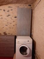a washer and dryer in a small room at La Maison Trésallet in La Plagne Tarentaise