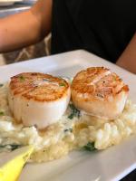 two pieces of scallops on a plate of food at Atlantic Beach Hotel Newport in Middletown