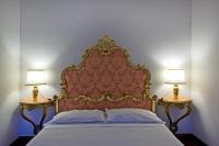 A bed or beds in a room at Cristina Rossi Bed&Breakfast