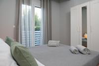 Posteľ alebo postele v izbe v ubytovaní Manos Housing Units