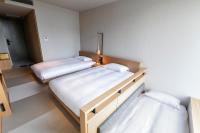 ONSEN RYOKAN 由縁 札幌にあるベッド