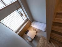 ONSEN RYOKAN 由縁 札幌にあるベッド