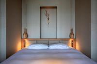 ONSEN RYOKAN 由縁 札幌にあるベッド