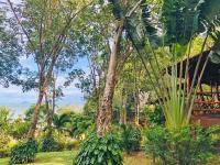 a jungle with trees and a tiger in the distance at Banyan Bay Villas in Ko Jum