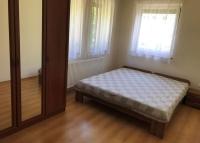 Posteľ alebo postele v izbe v ubytovaní Panoráma Apartman Ház