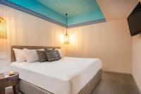 Ein Bett oder Betten in einem Zimmer der Unterkunft U Splash Resort Eilat