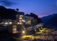 a building is lit up at night with lights at Onsen Papawaqa in Tai&#39;an