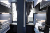 Postel nebo postele na pokoji v ubytování 3Howw Hostel @ Sukhumvit 21