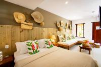 a bedroom with a large bed in a room at Pousada Por do Sol in Trancoso