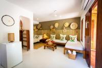a living room with a couch and a table at Pousada Por do Sol in Trancoso