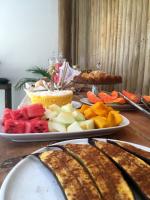 a table with two plates of food on it at Pousada Por do Sol in Trancoso