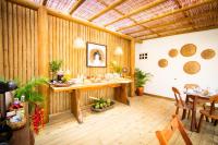a large room with a table and a dining room at Pousada Por do Sol in Trancoso