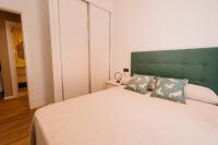 Posteľ alebo postele v izbe v ubytovaní Apartamentos Rúa Vella
