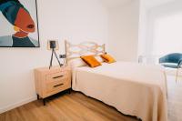 Posteľ alebo postele v izbe v ubytovaní Apartamentos Rúa Vella