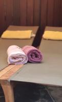 two purple towels are sitting on a table at B&amp;B Aquavert &amp; Wellness in Tournai