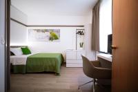 Łóżko lub łóżka w pokoju w obiekcie Bonotto Hotel Palladio