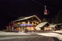 a ski lodge at night with a ski lift at Chalet-Hôtel de l&#39;Etape in Les Contamines-Montjoie
