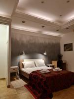 Posteľ alebo postele v izbe v ubytovaní Apartmani N.May's