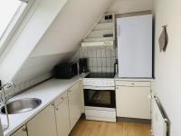 Kuchyň nebo kuchyňský kout v ubytování aday - Reberbansgade Apartment Suite