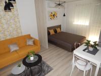 A bed or beds in a room at Pisztácia 2020 Apartman