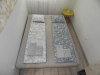A bed or beds in a room at Pisztácia 2020 Apartman