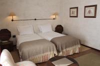Uma cama ou camas num quarto em Pousada Convento de Belmonte
