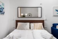 Posteľ alebo postele v izbe v ubytovaní Apartments Harbour View