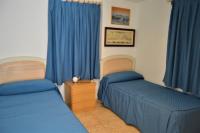 A bed or beds in a room at Casa Rural Consuelo