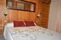 A bed or beds in a room at Casa Rural Consuelo
