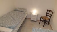 A bed or beds in a room at Appartamento In Paese
