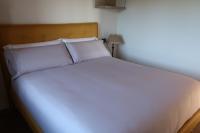 A bed or beds in a room at A Palleira de Lola
