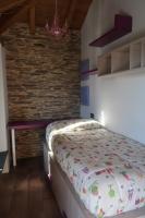 A bed or beds in a room at A Palleira de Lola