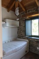 A bed or beds in a room at A Palleira de Lola