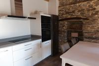 A kitchen or kitchenette at A Palleira de Lola