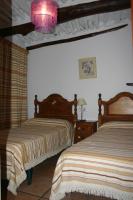 Posteľ alebo postele v izbe v ubytovaní Apartamentos y Casas Rurales Las Terrazas de la Alpujarra