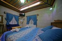 Postel nebo postele na pokoji v ubytování Cappa Cave Hotel