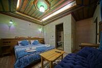 Postel nebo postele na pokoji v ubytování Cappa Cave Hotel