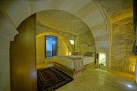 Postel nebo postele na pokoji v ubytování Cappa Cave Hotel