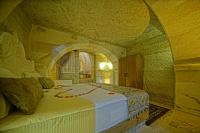 Postel nebo postele na pokoji v ubytování Cappa Cave Hotel