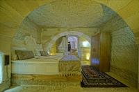 Postel nebo postele na pokoji v ubytování Cappa Cave Hotel
