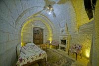 Postel nebo postele na pokoji v ubytování Cappa Cave Hotel