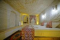 Postel nebo postele na pokoji v ubytování Cappa Cave Hotel