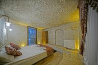 Postel nebo postele na pokoji v ubytování Cappa Cave Hotel