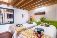 Postel nebo postele na pokoji v ubytování Casa Drago - Villa Perenquén